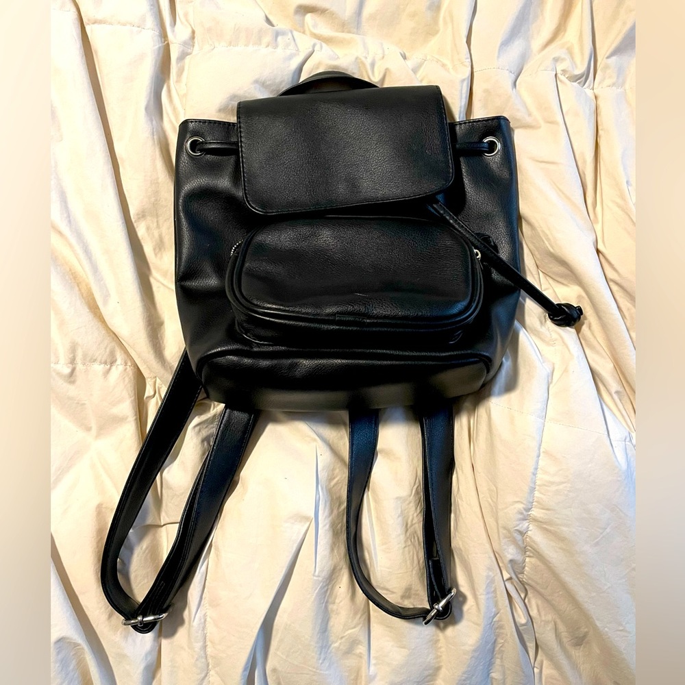 Black small backpack. Great for theme park use or to travel!
